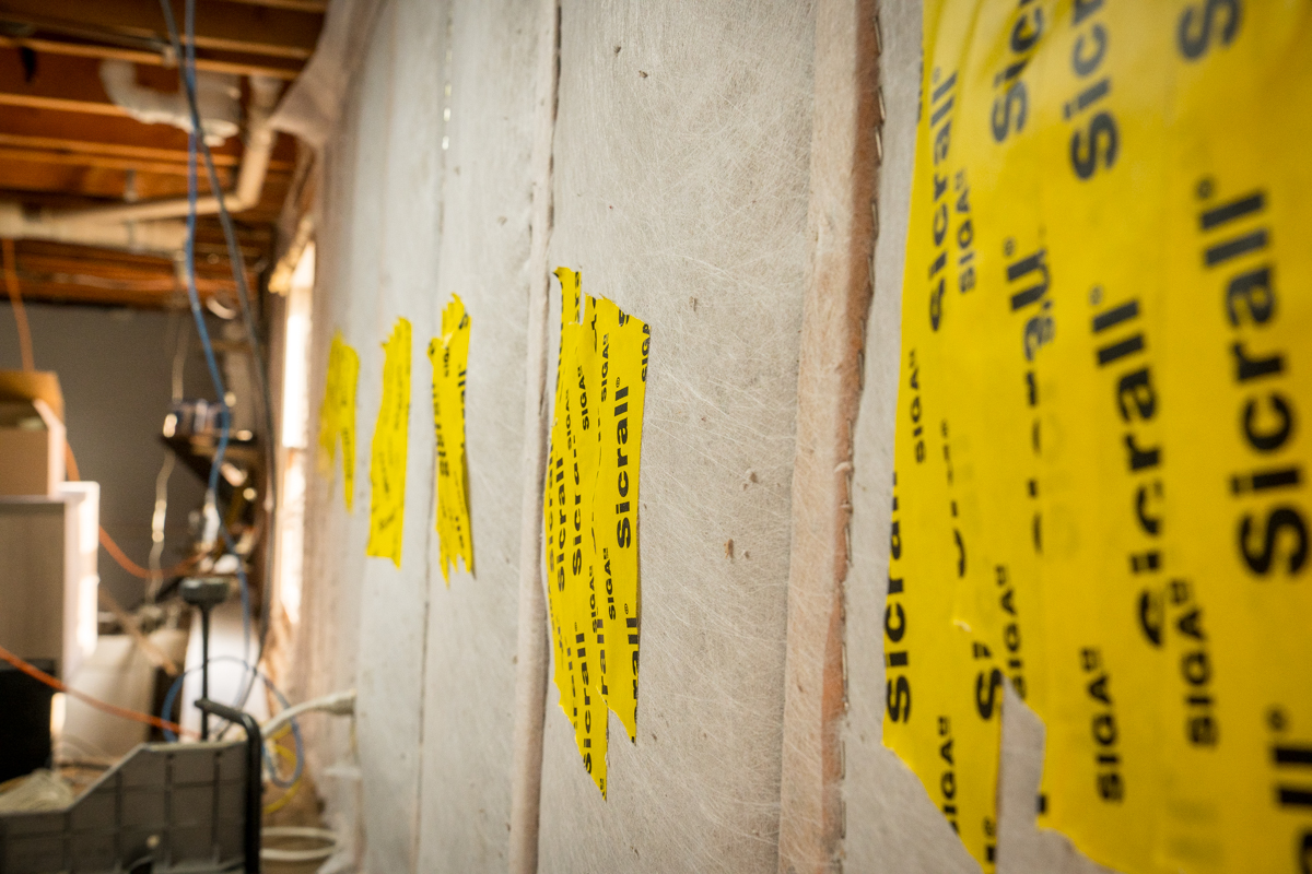 Horizon Homes crew member performing a home energy assessment in a Maine home