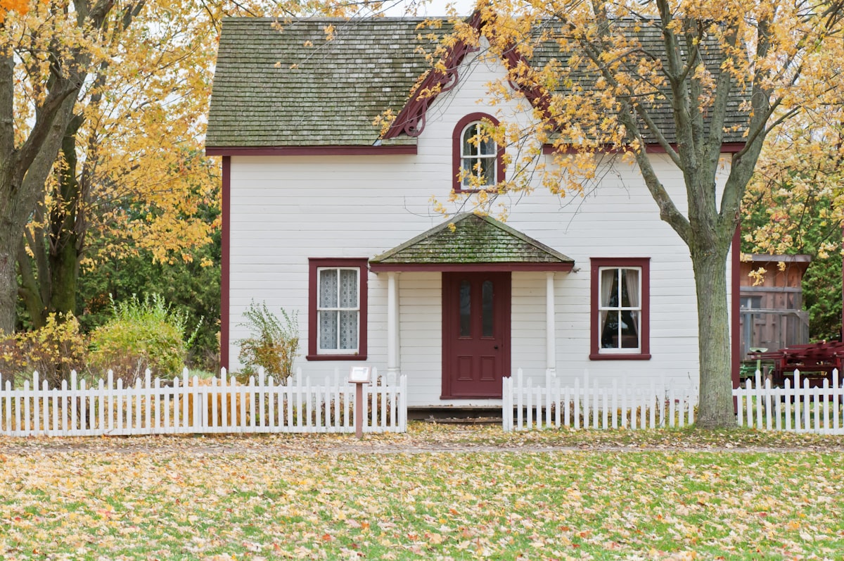 Young couple reviewing energy bills in their older Maine home during winter