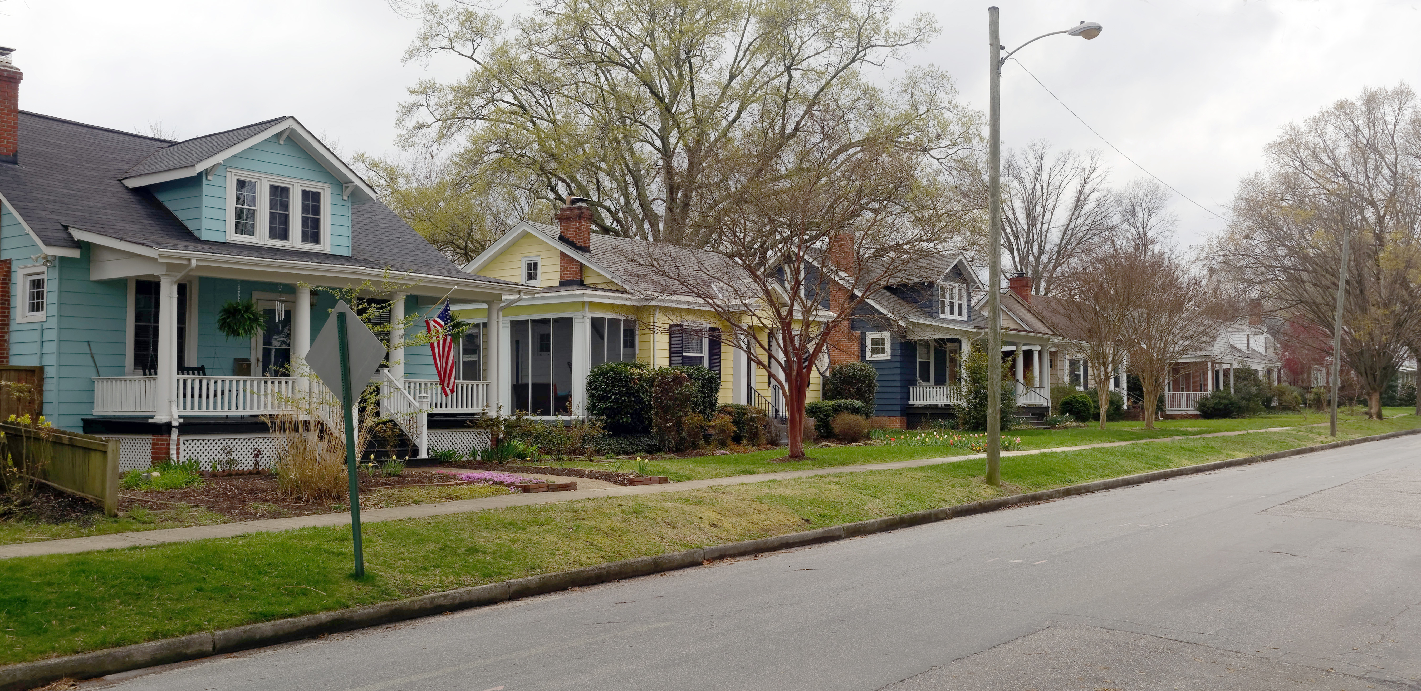 Ranch-style home in South Portland Maine with Horizon Homes crew performing insulation work