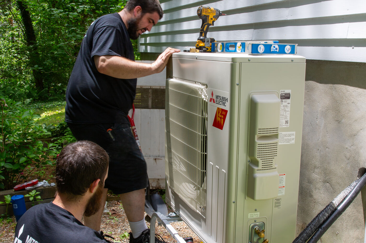 Cold-climate heat pump outdoor unit installed at a Cape Cod style home in Portland Maine