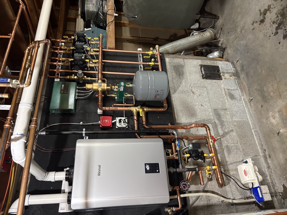 Modern wall-hung condensing propane boiler installed in a Maine home basement