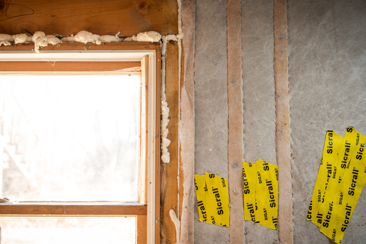 Horizon Homes crew performing weatherization work on a Maine home including insulation and air sealing