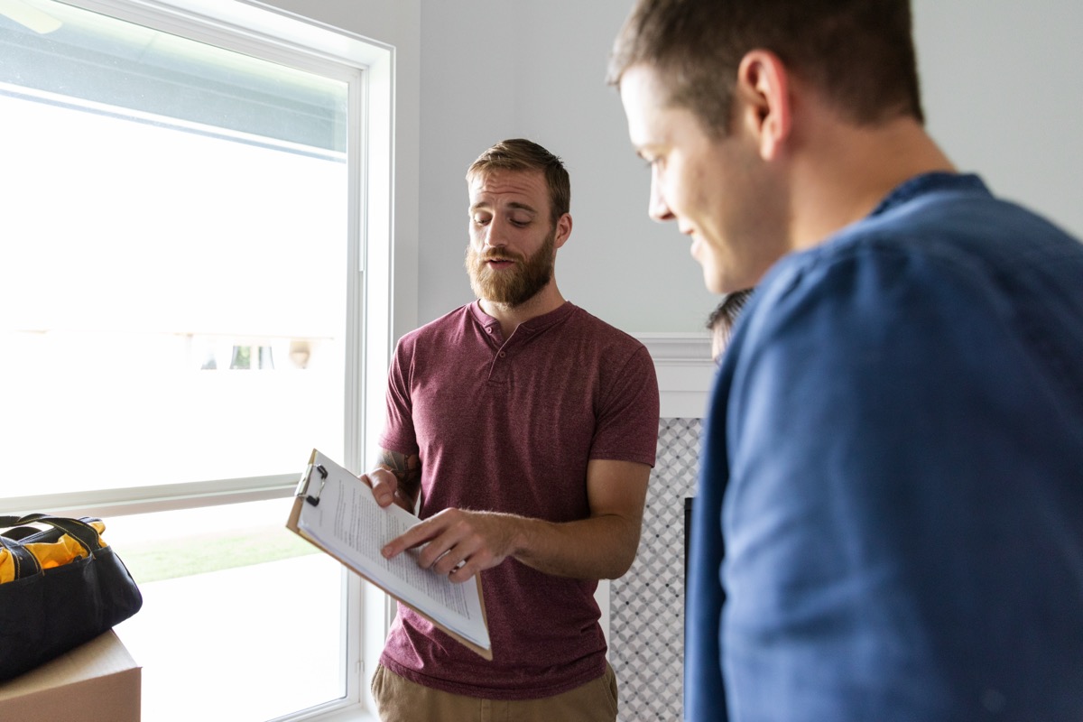 Energy advisor reviewing assessment findings with a homeowner