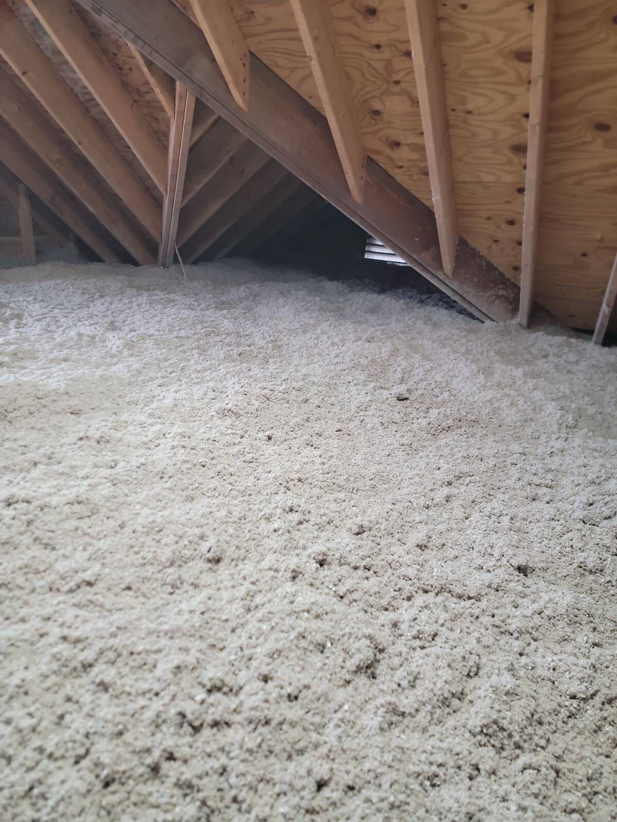 Attic insulation installation with cellulose blown to R-50
